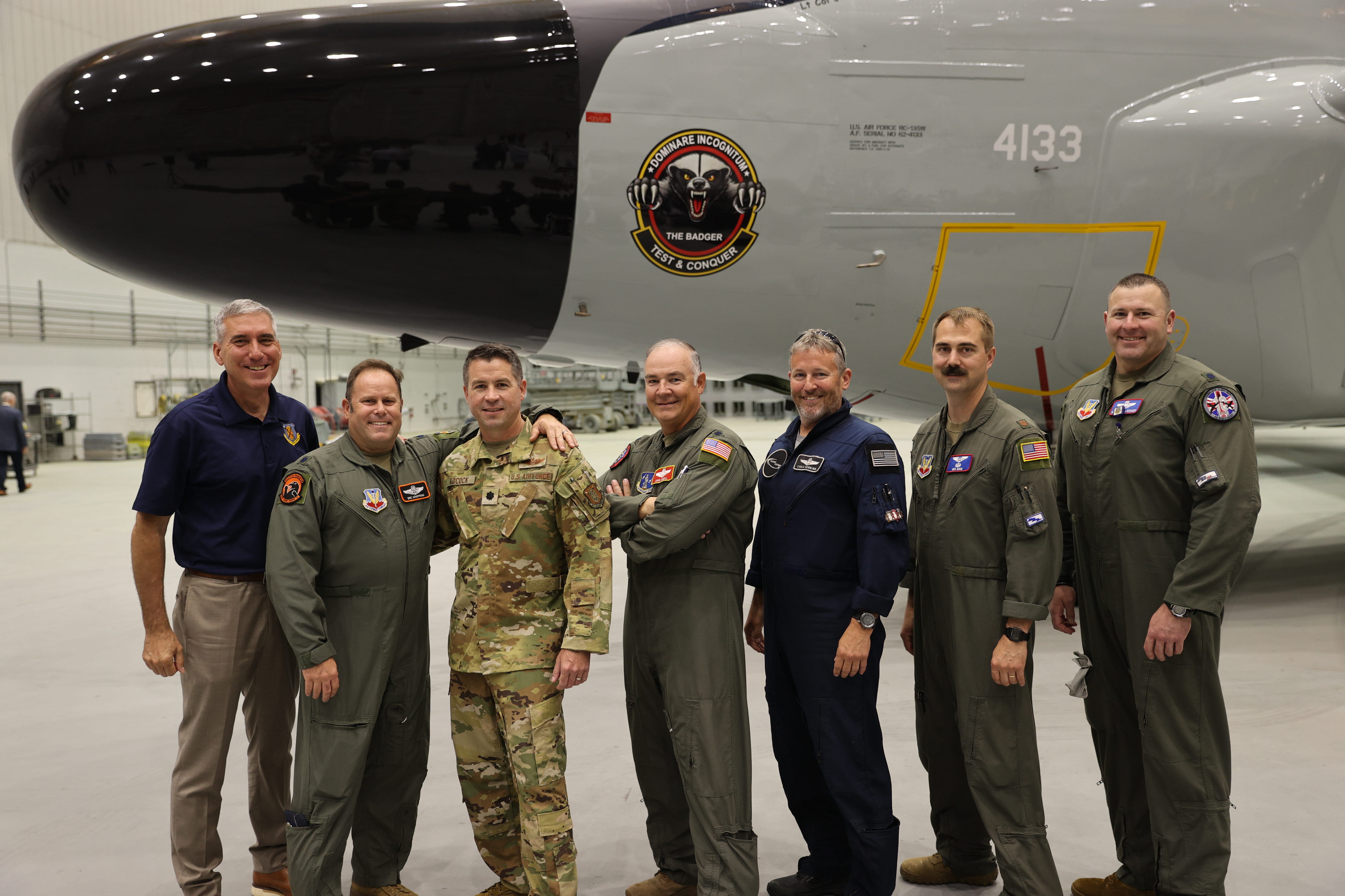 Calvert team members with an NC-135 aircraft